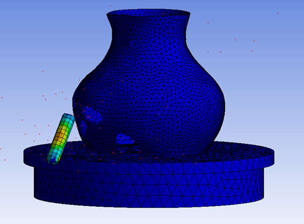 Example of Eroded Material in a Model Simulating a Bullet going Through a Vase (eroded elements colored red)